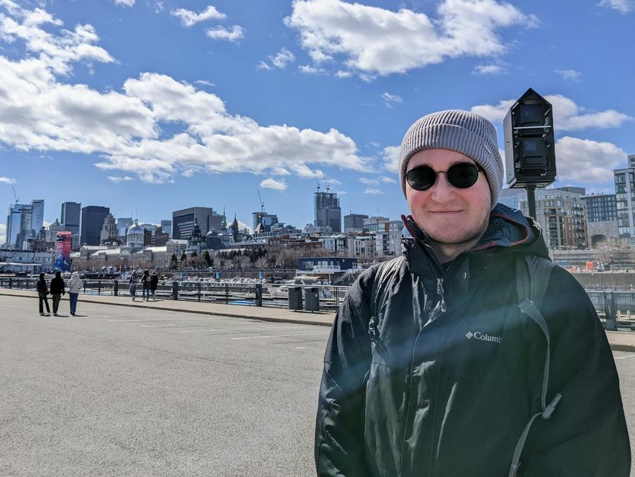 Photo of me looking cold in front of a view of Montreal.