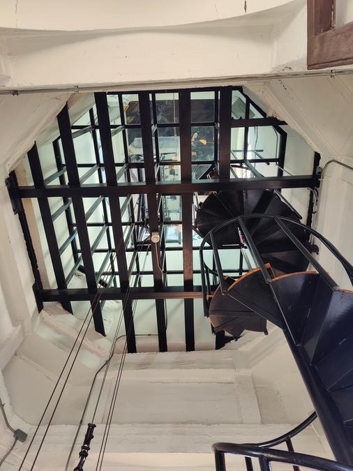 View of the spiral tower stairs from the bottom.