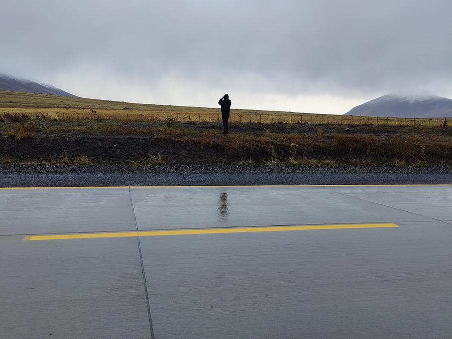 A photo of Aishwarya taking a photo of a mountain.